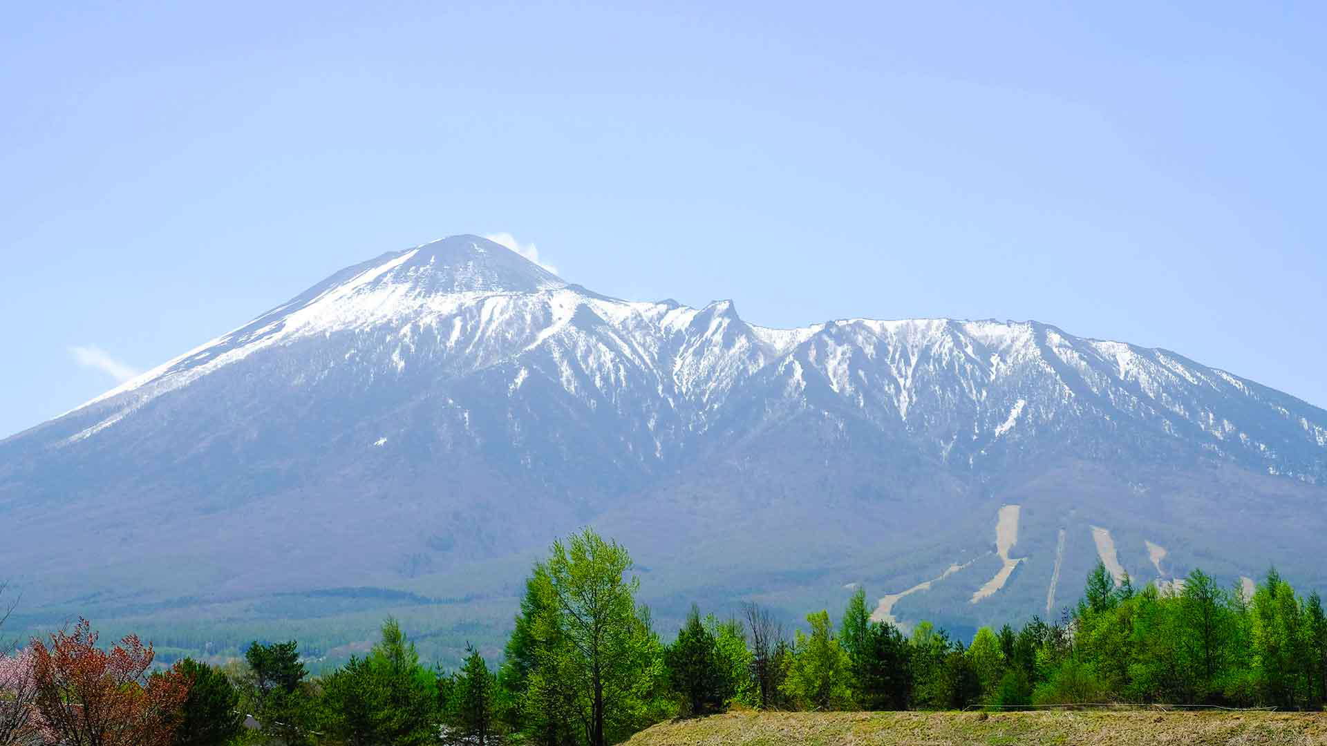 Snow-dusted Mount Asama in Japan on a clear day