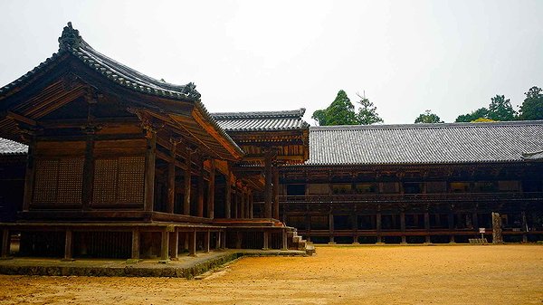 Ancient wooden temple architecture in serene Japanese setting