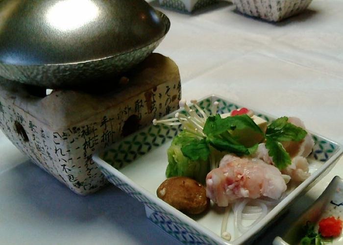 Wakayama fish nabe with a small nabe hot pot and a dish of fish and other ingredients