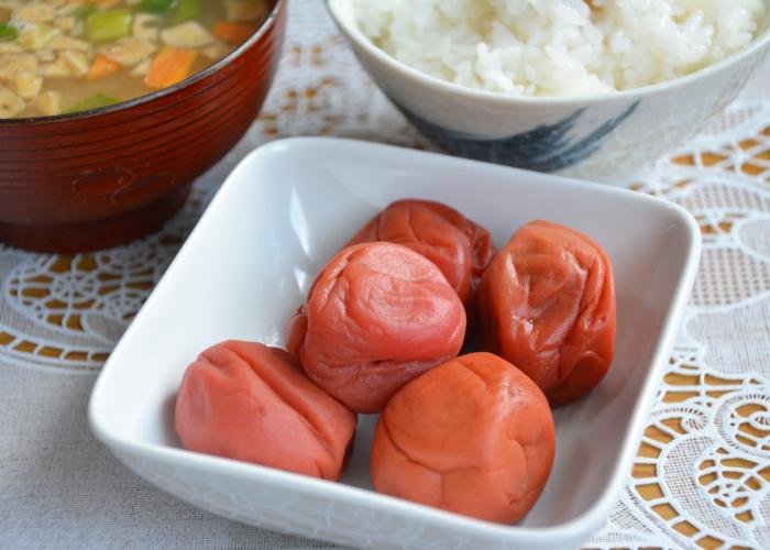 Umeboshi, Japanese pickled plums, in a white dish