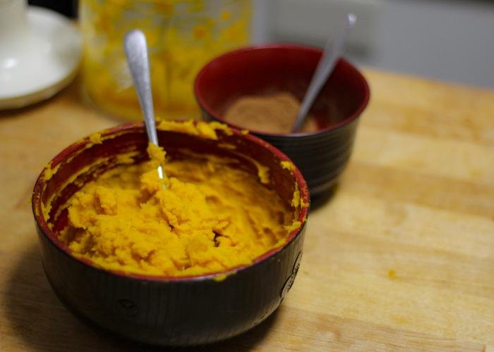 Preparing the Kabocha Pie batter with a fork and spoon