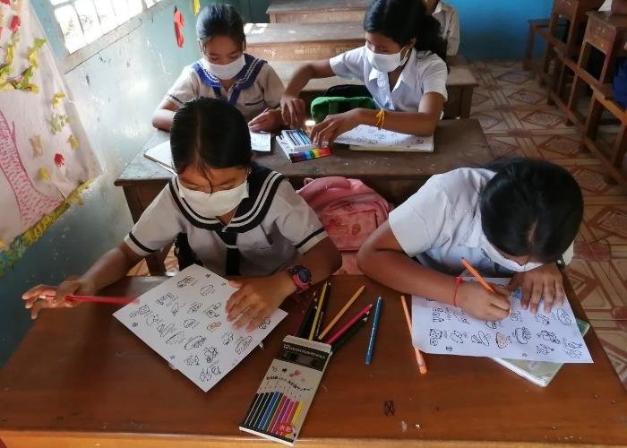 Cambodian children drawing during a nutrition workshop 