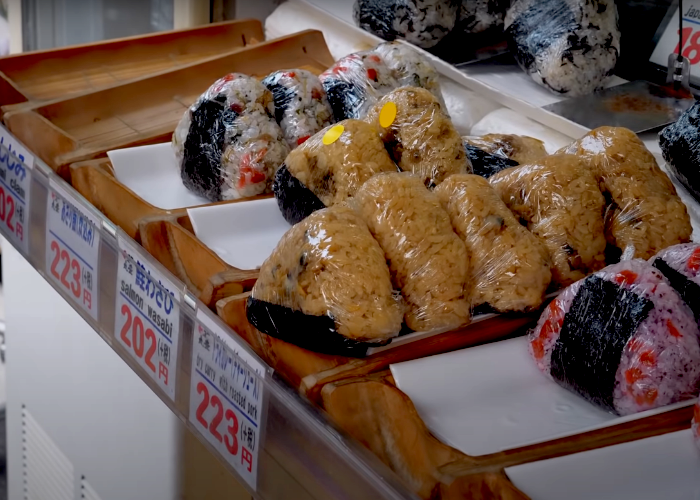 Rows of various styles of onigiri rice balls at a shop in Tsukiji Market