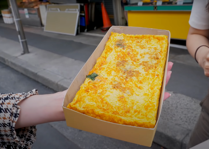 A staple Tsukiji street food, a block of tamagoyaki (Japanese rolled omelet)