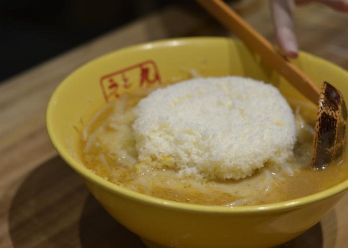 Cheese ramen in Tokyo with a big mound of gouda cheese on top