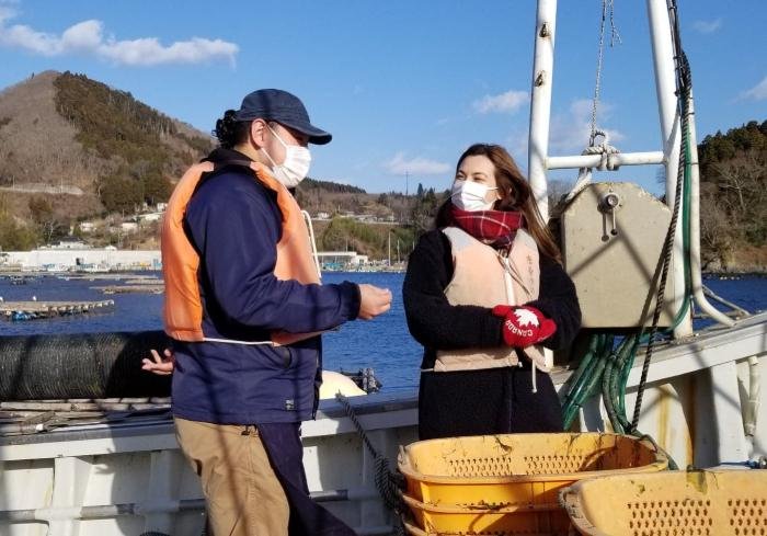Sugawara HIroki and Shizuka Anderson on a boat for the Sake in the Sea experience