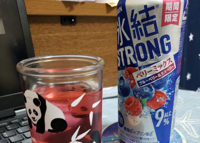 Tall can of mixed berry Kirin Strong chuuhai, pink chuuhai poured into panda glass