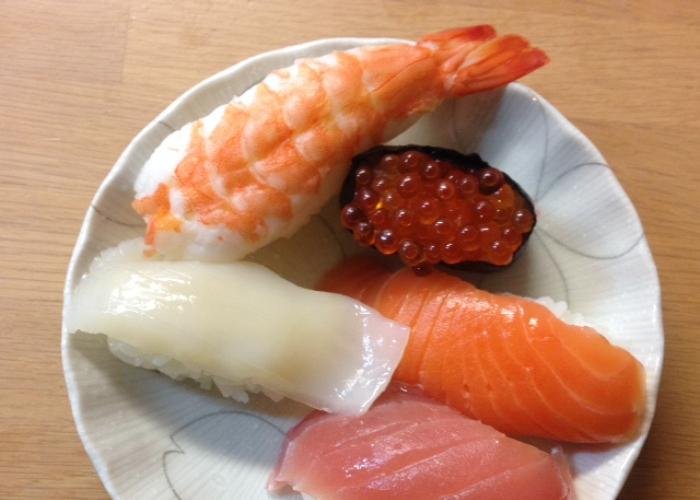 Assorted sushi plate with nigiri sushi like shrimp and ika