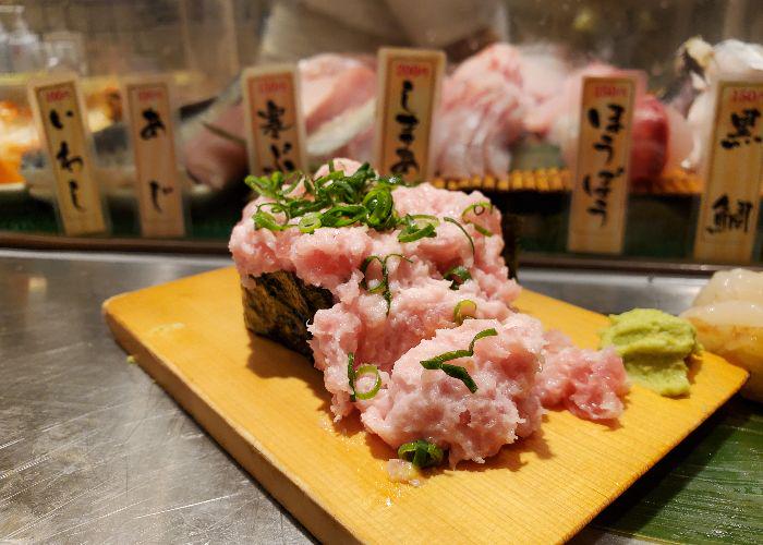 Negitoro sushi on a platter at Uogashi Nihonichi Standing Sushi Bar