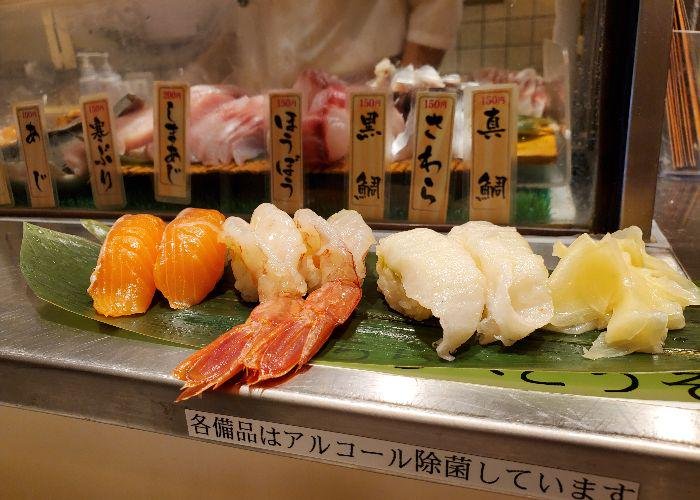 6 pieces of nigiri sushi including ebi sushi at Uogashi Nihonichi