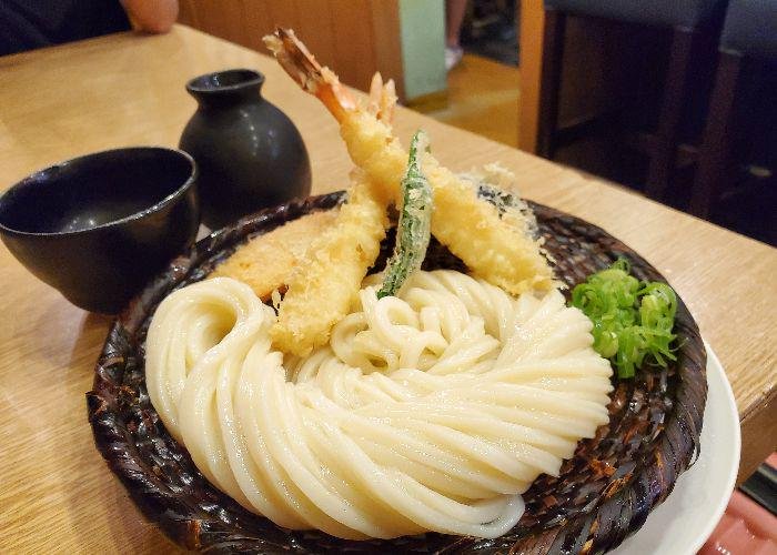 Bowl of udon noodles accompanied by tempura at Udon from Shin Udon 