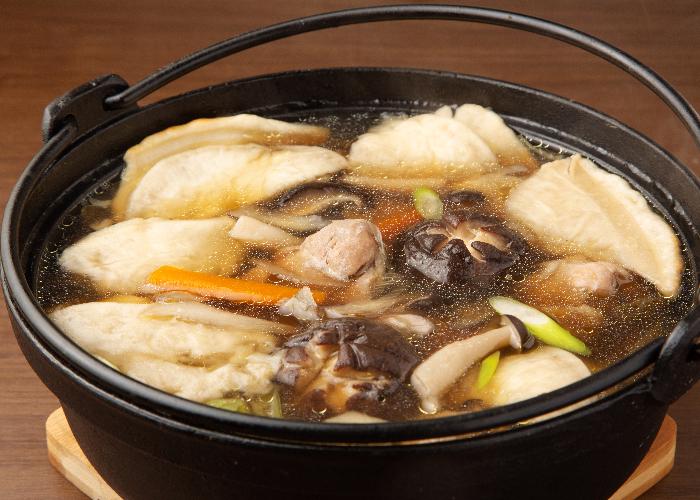 An iron pot of Senbei-jiru, rice cake soup from Aomori prefecture