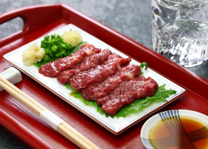 Basashi, raw horse, on a plate served as sashimi