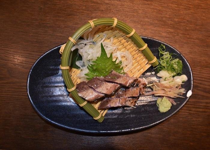 Glistening Katsuo no Tataki beautifully plated on a dish