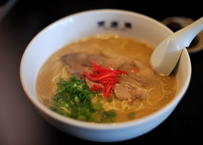 Hakata ramen with a thick, potent broth, topped with scallions