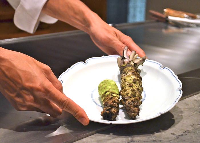 Chef showing a plate of Japanese wasabi