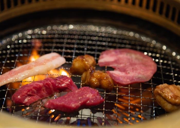 Horumon, Japanese offal, pieces of Japanese local beef being grilled over flame