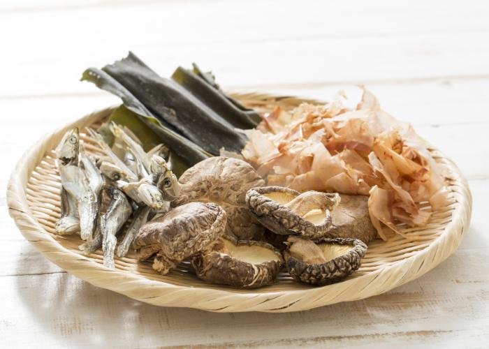 Dashi ingredients including shiitake mushrooms, katsuobushi, and kombu