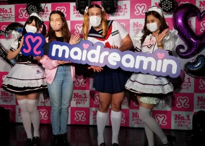 Shizuka and Ladybeard onstage with two girls dressed in maid uniforms at Maidreamin in Akihabara
