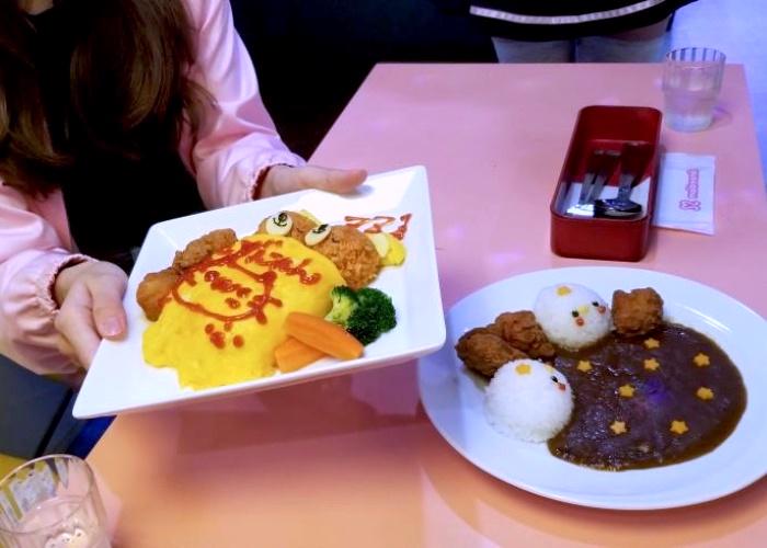 A plate of omurice and karaage fried chicken at Maidreamin Maid Cafe in Tokyo