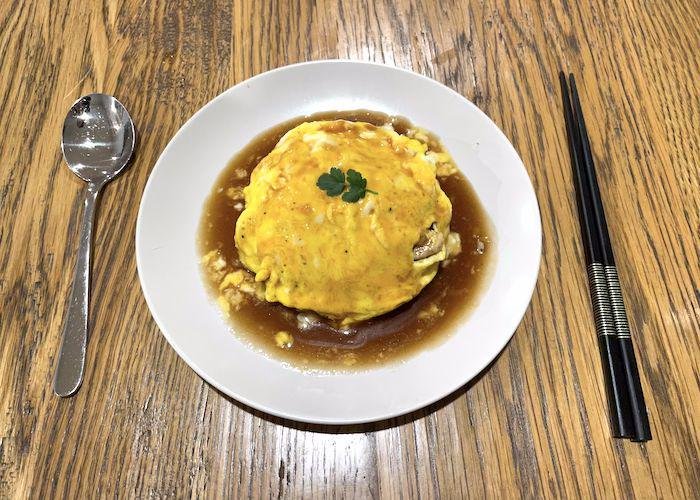 Kichi Kichi Style Omurice on wooden table with demi-glace
