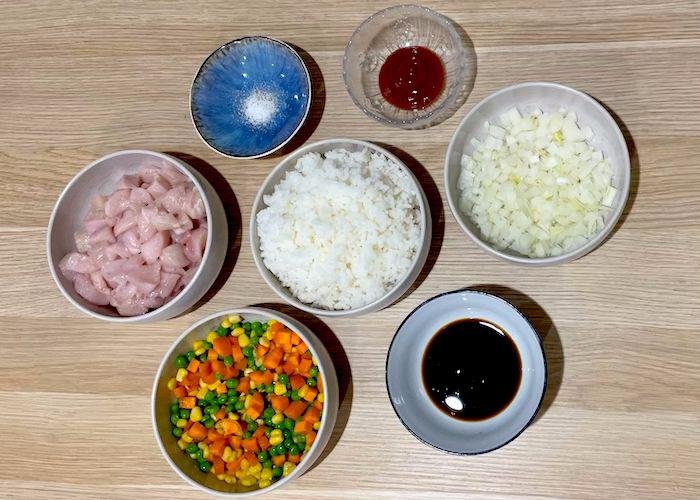 Ingredients for chicken fried rice in bowls
