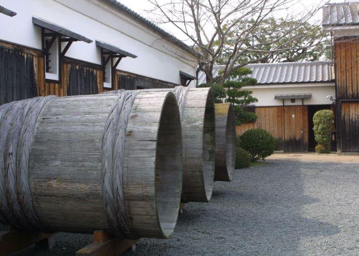 Big wooden barrels outside a sake brewery in Fushimi