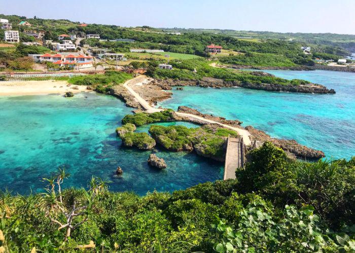 An image of a footpath on Miyako Island across the turquoise ocean