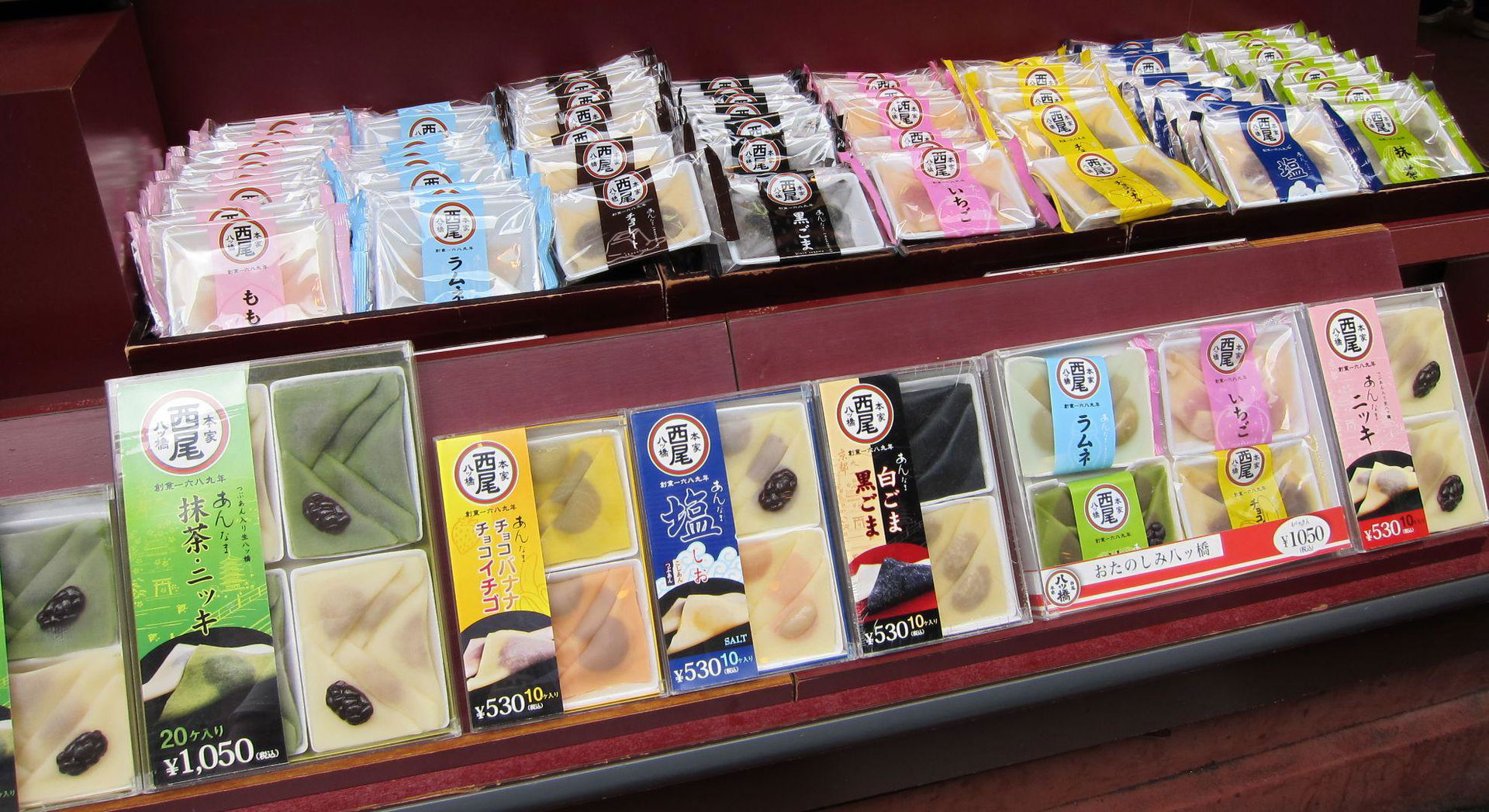 Colorful packaged desserts on display in a Japanese store
