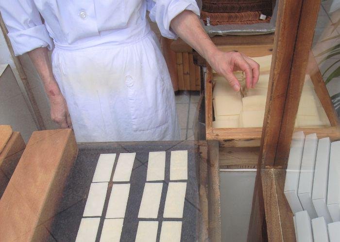 Baking yatsuhashi on a flat hotplate at a stall