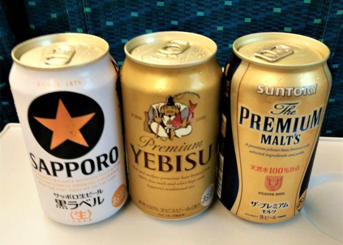 3 cans of Japanese beer on a shinkansen fast traina