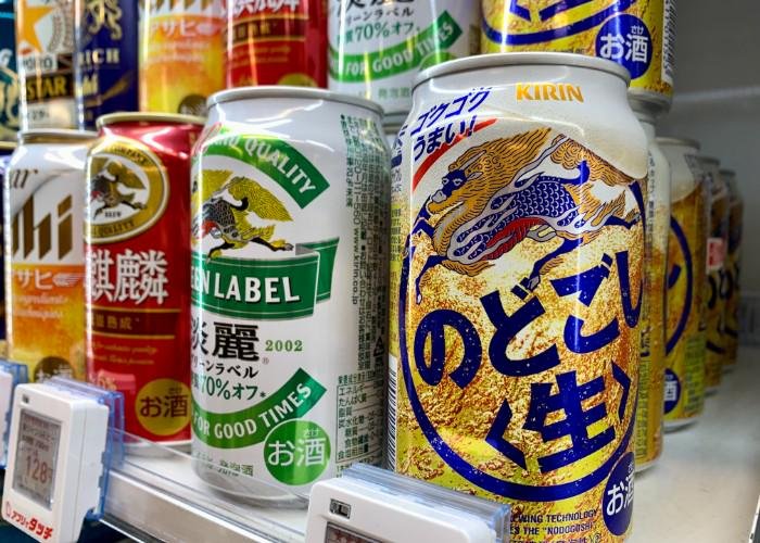 Cans of Japanese beer on a shelf