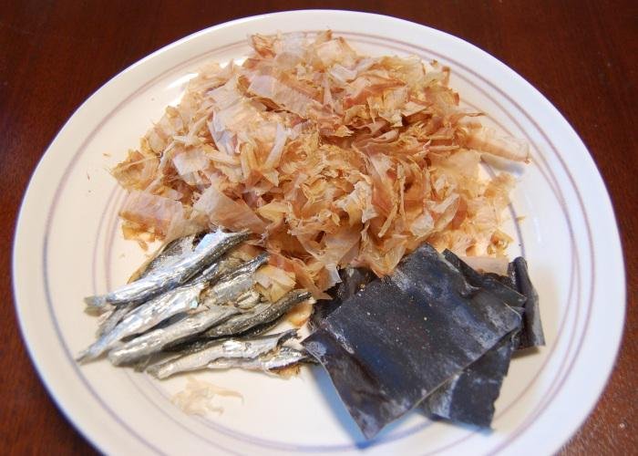 Dashi ingredients of bonito flakes, konbu kelp, and sardines