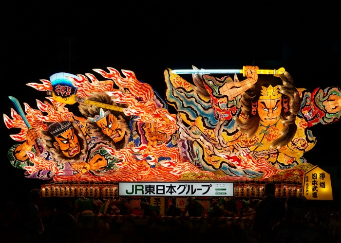 Aomori Nebuta Festival Float with traditional designs lit up at night