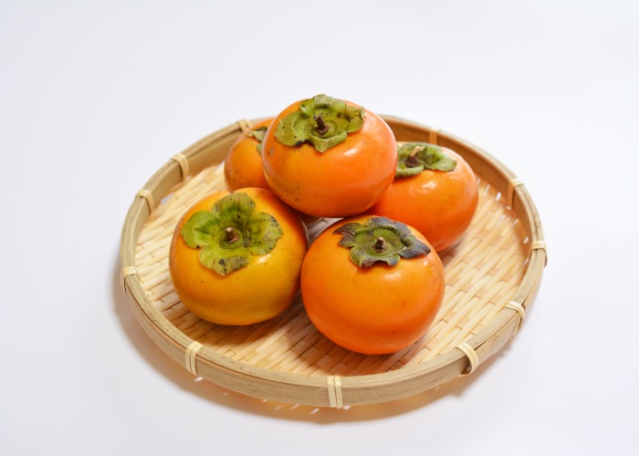 Persimmons in a basket.