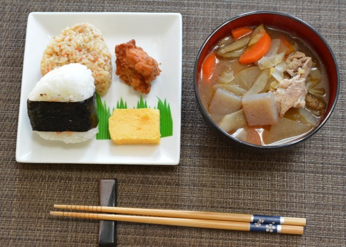 Japanese meal of tonjiru soup and some onigiri balls