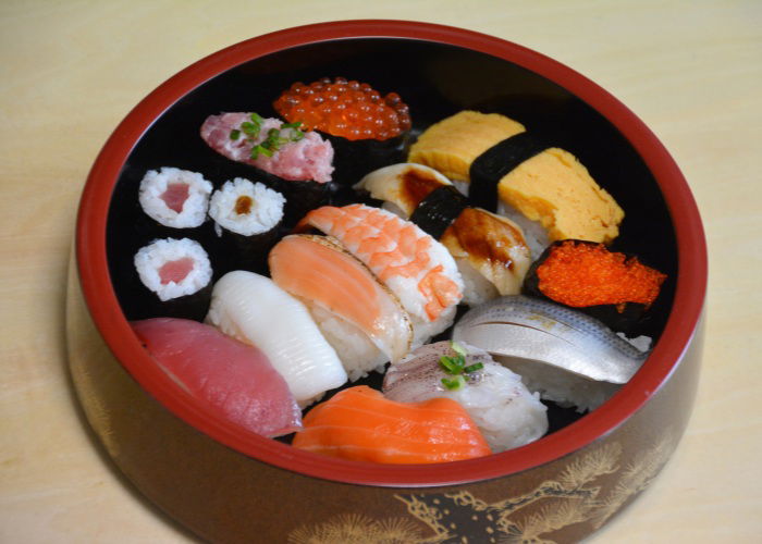 Sushi in a round lacquer bowl