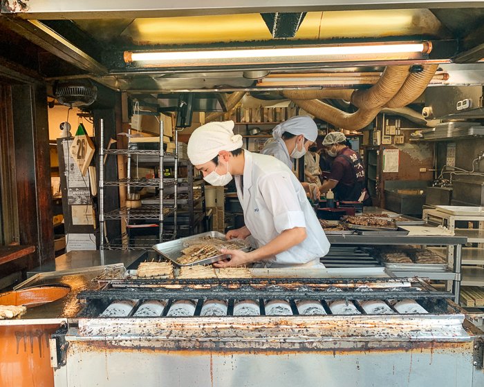 Men making grilled eel in Narita, Japan