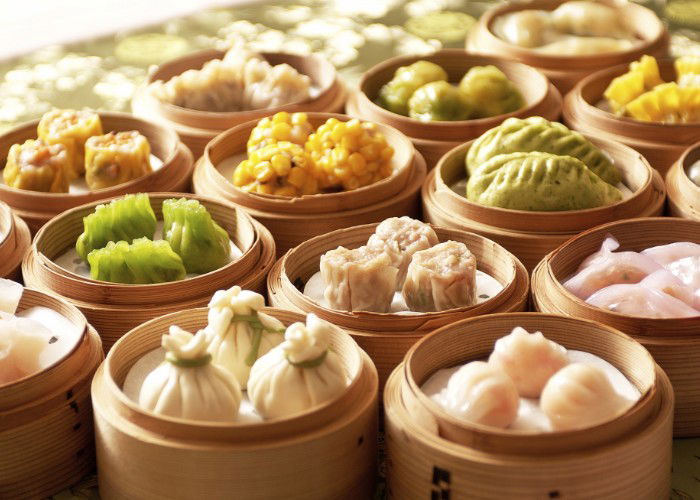 A variety of dumplings in little serving bowls 