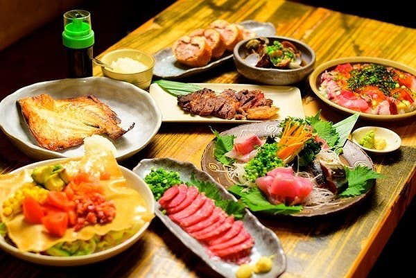 Colorful restaurant table with a variety of gourmet dishes
