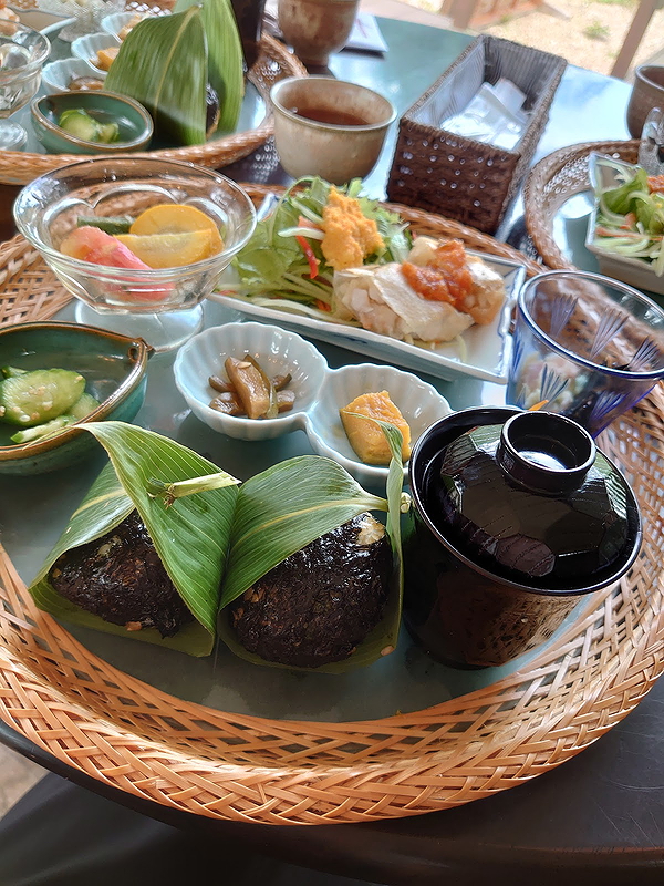 Traditional Japanese meal served on a woven bamboo tray