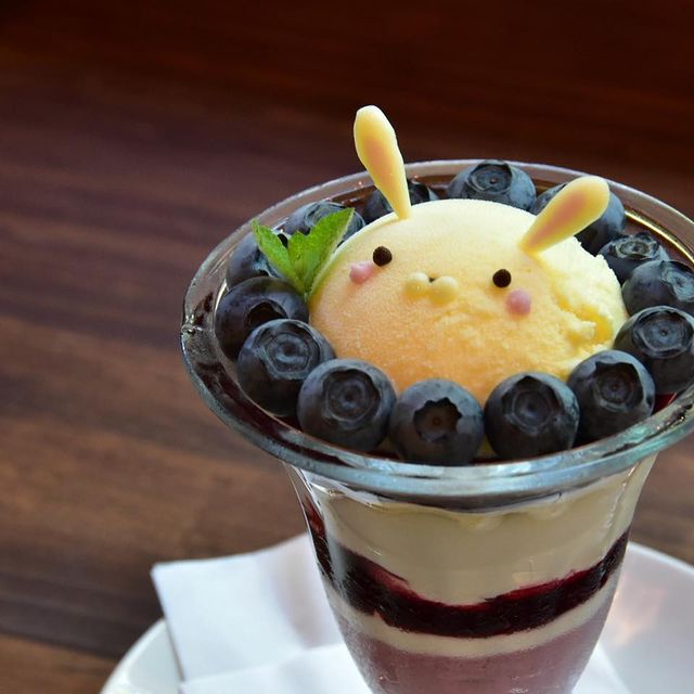 Blueberry parfait with cute animal-shaped ice cream topper
