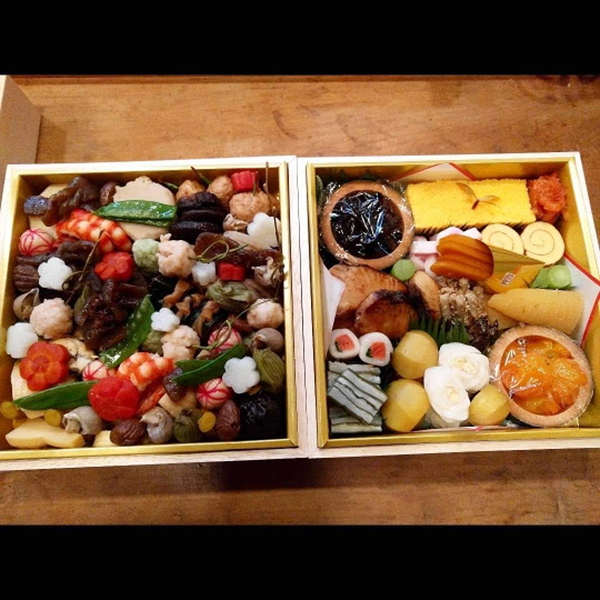 Colorful assortment of traditional Japanese bento boxes.