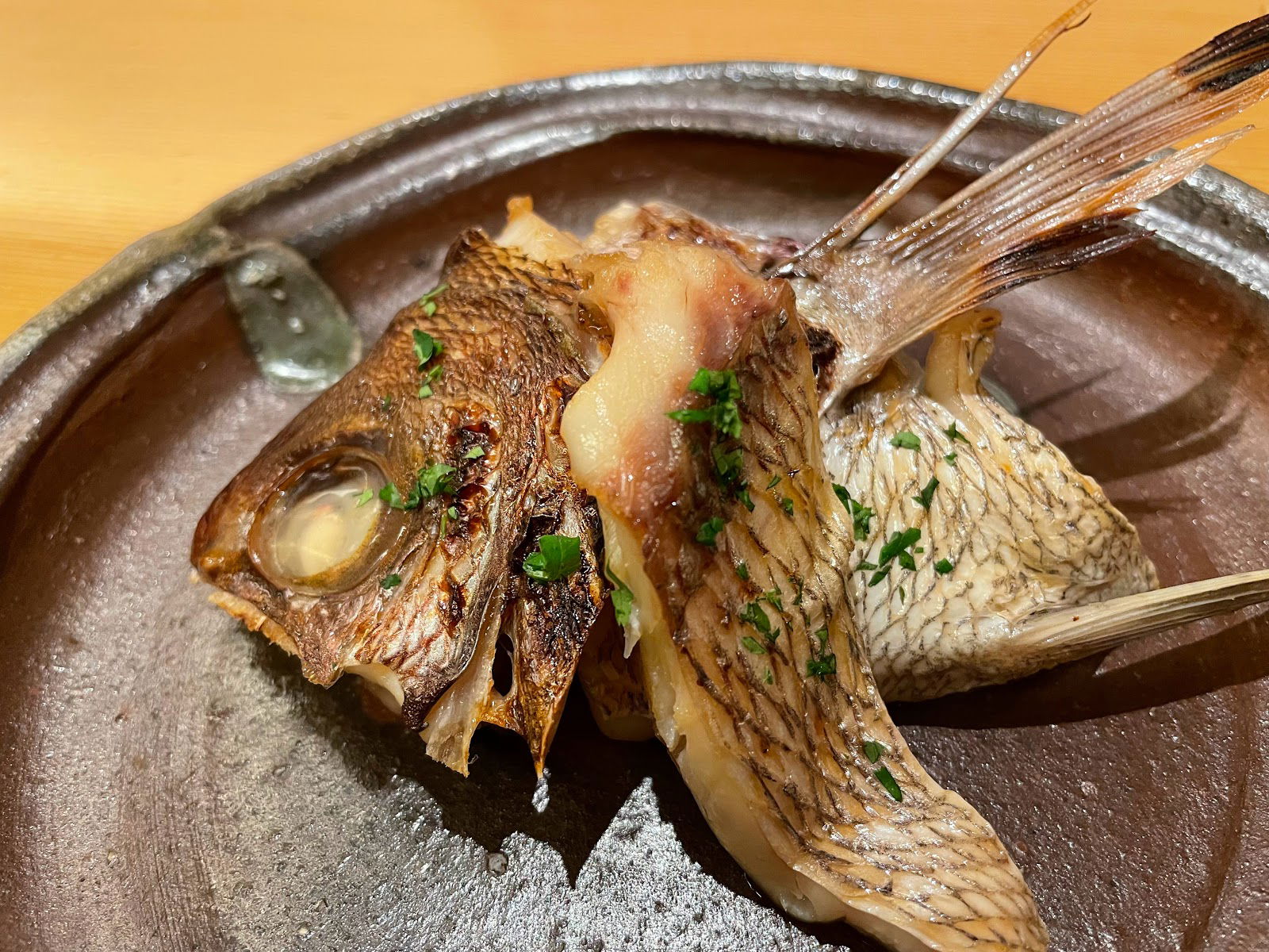 A grilled fish served whole at Araragi.