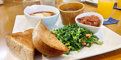 Healthy breakfast platter with toast, salad, and dips