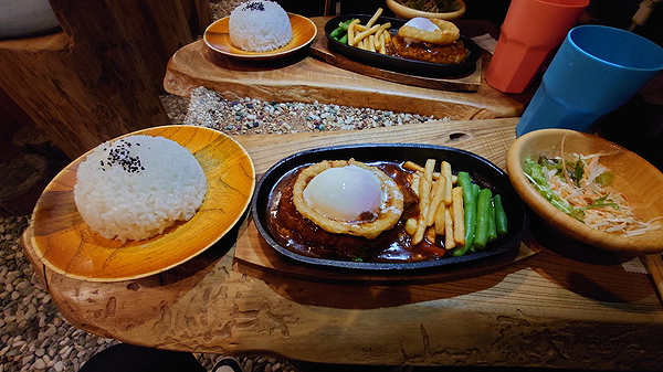 Sizzling steak and rice meal served at a rustic restaurant