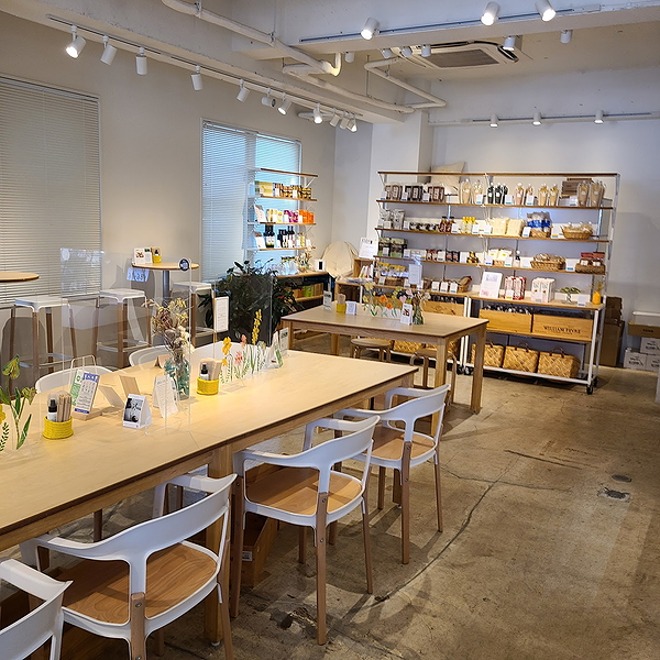 Cozy modern café interior with wooden tables and shelves