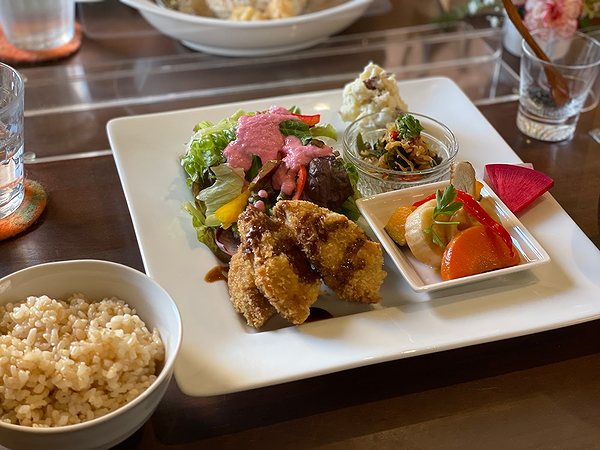 Elegant plated meal at upscale restaurant, featuring diverse culinary dishes.