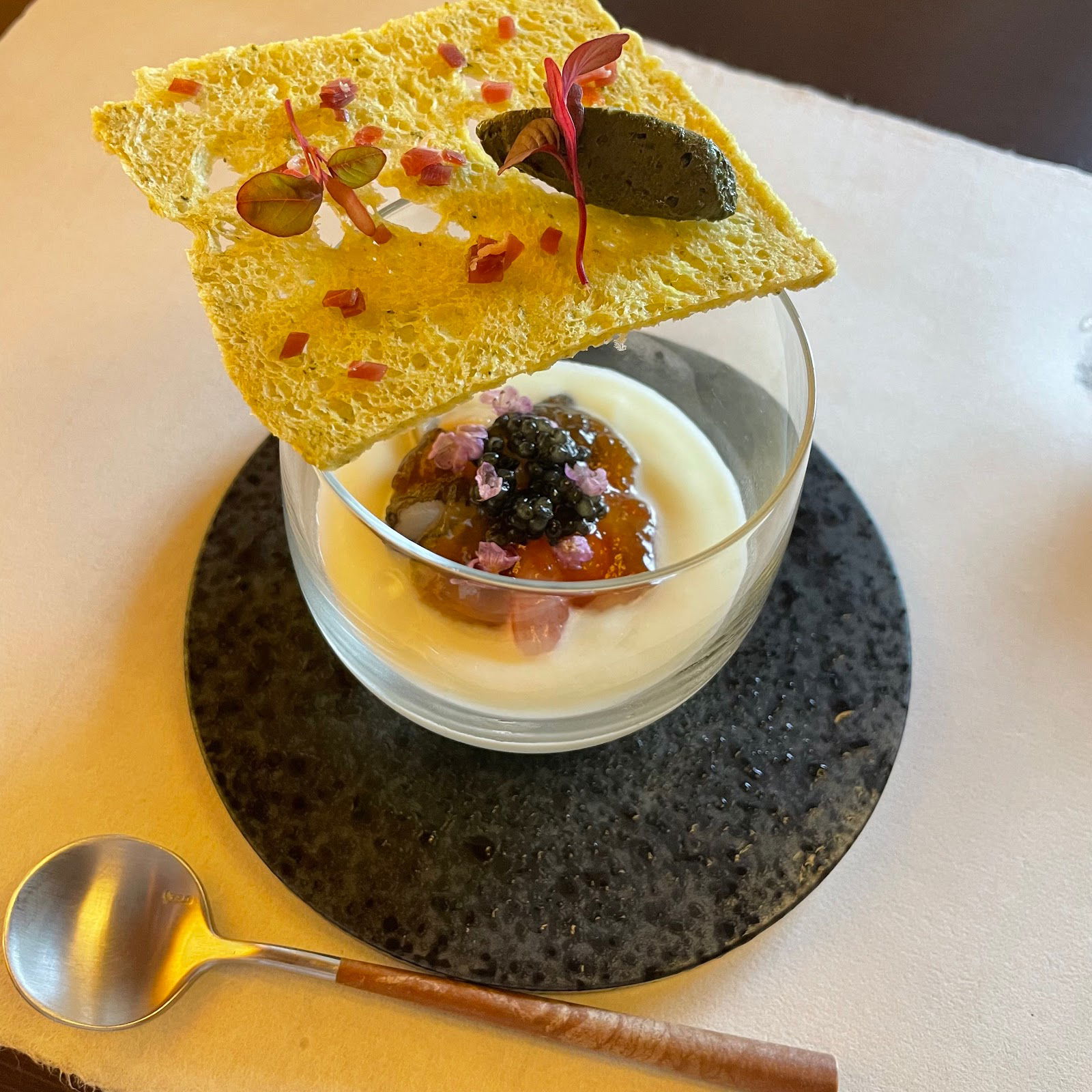 A picturesque starter at L’Ensoleiller; a square of crusty bread resting on a glass.