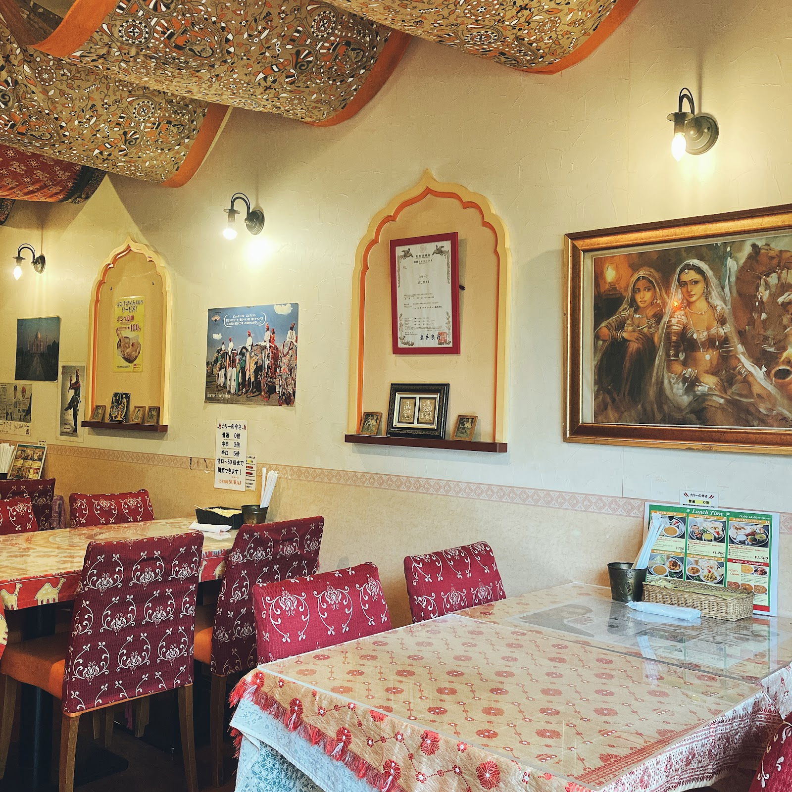 Cozy Indian restaurant interior with vibrant decor and wall art